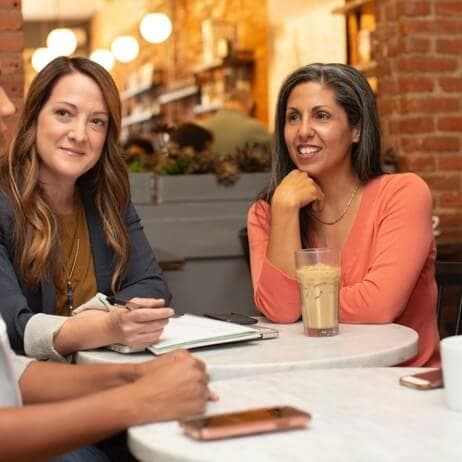 A SeniorLeaf adviser listening across a table